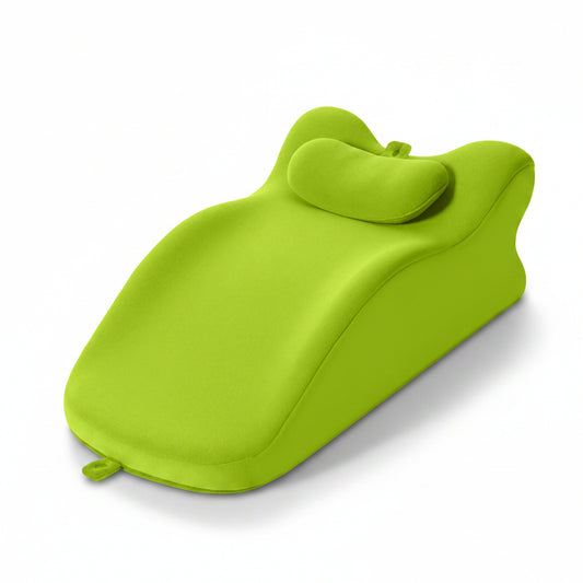 Green bath pillow on a white background