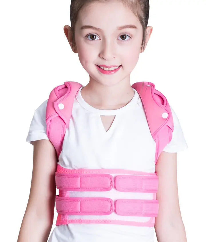 Child wearing a pink back brace against a white background