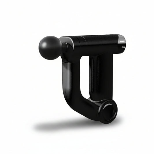 Black handheld massage tool on a gray background
