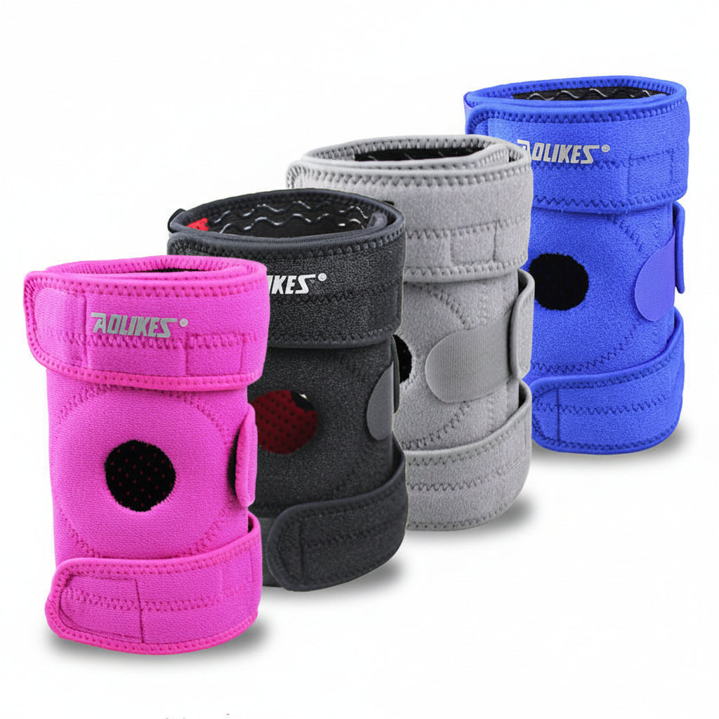 Four knee pads in pink, black, gray, and blue on a light gray background
